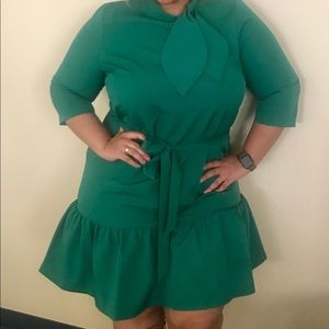 tie neck green knee length ruffle bottom dress